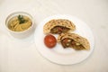 Popular Israeli dish - falafel in a plate on a white tablecloth