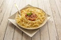 Popular Italian recipe for spaghetti with bolognese sauce, lots of grated Parmesan cheese with parsley