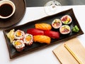 Popular Japanese dish sushi combo, which includes of Uramakis, Makis and Nigiris Royalty Free Stock Photo