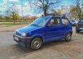 Dark blue old Polish car Fiat Cinquecento private car parked