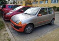 Small and old grey and orange Polish car Fiat Seicento private car parked Royalty Free Stock Photo