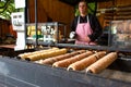 A popular national street food of the Czech Republic. Baking at the street stalls of the popular Trdlo