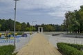 Popular North park for rest with autumnal old forest, bench, open-air kindergarten and lake in Vrabnitsa district