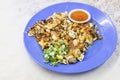 Popular Penang fried oyster omelette egg served with chilli dip Royalty Free Stock Photo