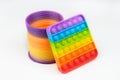 Popular plastic Slinky toy and Rainbow Square Fidget Toys Pop-it on the white background Royalty Free Stock Photo