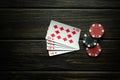 Popular poker game with royal flush winning combination. Cards with chips on a black vintage table in a poker club. Free black Royalty Free Stock Photo