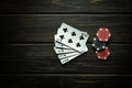 Popular poker game with straight flush winning combination. Cards with chips on a black vintage table in a poker club. Free black