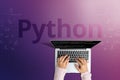 The popular Python programming language with a person behind a laptop