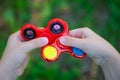 Popular red plastic finger spinner Royalty Free Stock Photo