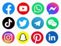 Popular social network logos printed on paper: Facebook, YouTube, Watsap, Tiktok, Twitter, Telegram, Wechat, Instagram