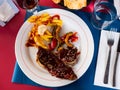 Grill dish Churasco of beef with barbecue sauce with vegetables Royalty Free Stock Photo