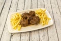 Popular Spanish stew of oxtail with potato chips garnish Royalty Free Stock Photo