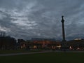Square Schlossplatz in evening with the silhouette of JubilÃÂ¤umssÃÂ¤ule and building KÃÂ¶nigsbau during Christmas season. Royalty Free Stock Photo