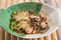 Popular street food in Thailand Kuai Tiao Moo Namtok that consisted of pork ball, pork meat, basil or thyme, bean sprouts, Royalty Free Stock Photo