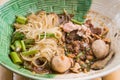 Popular street food in Thailand Kuai Tiao Moo Namtok that consisted of pork ball, pork meat, basil or thyme, bean sprouts, Royalty Free Stock Photo