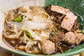 Popular street food in Thailand Kuai Tiao Moo Namtok that consisted of pork ball, pork meat, basil or thyme, bean sprouts, Royalty Free Stock Photo