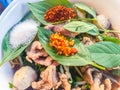 Popular street food in Thailand, Spicy pork noodle that consisted of pork ball, pork meat, basil or thyme, bean sprouts, morning Royalty Free Stock Photo