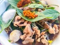 Popular street food in Thailand, Spicy pork noodle that consisted of pork ball, pork meat, basil or thyme, bean sprouts, morning Royalty Free Stock Photo