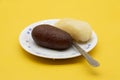 Popular Sweet, Rasgulla Also Know as Rosogolla, kalojam, isolate on yellow background