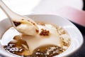 Popular Taiwan gourmet - Dessert of tapioca pearl ball bubble mixed bean curd tofu pudding douhua, dou hua in white bowl,