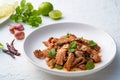 Popular Thai food.Spicy Grilled Pork Salad,grill pork with Charcoal and sliced mixed with lime juice,fish sauce,sugar and chilli Royalty Free Stock Photo