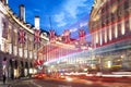 Popular tourist Regent street with flags union jack at night Royalty Free Stock Photo