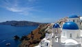 The popular town of Oia in Santorini - the top view on the beach, white houses and blue roofs