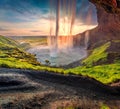 PopulaÃÂº tourist destination - Seljalandsfoss waterfall, where tourists can walk behind the falling waters.