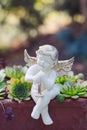 Porcelain angel as decoration in the garden Royalty Free Stock Photo