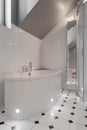 Porcelain bathtub in white washroom Royalty Free Stock Photo
