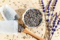 Dried lavender, spoon and tea bag sachet on wooden table. Organic flower herbal drink. Zero waste wrapper. Royalty Free Stock Photo