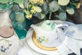 Porcelain ceramic teapot on a served table. Crockery and kitchen textiles Royalty Free Stock Photo