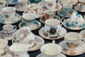 Porcelain cups on countertop in sunday flea market Royalty Free Stock Photo