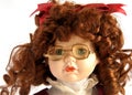 Porcelain doll face with spectacles Royalty Free Stock Photo