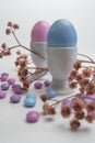 Porcelain Egg Cups with pink and blue Easter egg. Royalty Free Stock Photo