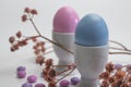 Porcelain Egg Cups with pink and blue Easter egg. Royalty Free Stock Photo