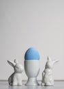 Porcelain Egg Cups with pink Easter egg and porcelain Easter bunnies Royalty Free Stock Photo