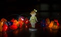 Porcelain girl figurine in a dark christmas interior