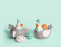 Porcelain glazed hens. easter decor, stand on a blue background. Royalty Free Stock Photo