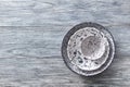 Decorative pottery - bowls, plates covered with glazed on a gray wooden background. Top view of traditional handcrafted. Royalty Free Stock Photo