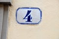Porcelain house number four Royalty Free Stock Photo