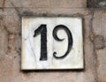 Porcelain house number nineteen Royalty Free Stock Photo