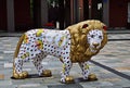 Porcelain lion figure in front of Herend Museum