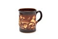Porcelain mug with relief drawing Royalty Free Stock Photo