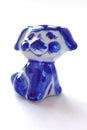 Porcelain puppy style of Gzhel on a white background. Small toy dog. Traditional Russian ornament.
