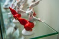 Assortment of rare porcelain figurines on glass shelf Royalty Free Stock Photo