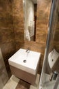 Porcelain sink inside small bathroom