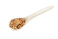 A porcelain spoon with rock sugar inside top view Royalty Free Stock Photo