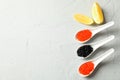 Porcelain spoons with caviar and lemon slices Royalty Free Stock Photo