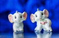 Porcelain statuette, porcelain statuette of the elephant on a blue background Royalty Free Stock Photo